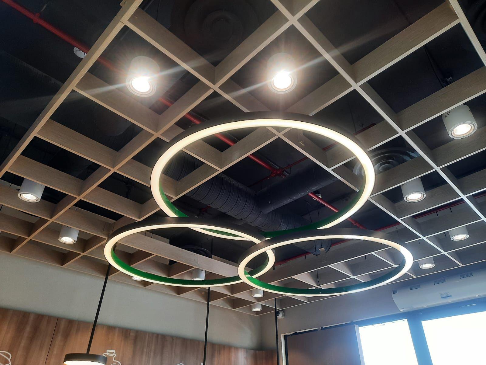 Saldwich, Riyadh: an open grid ceiling with interlocking rings of light